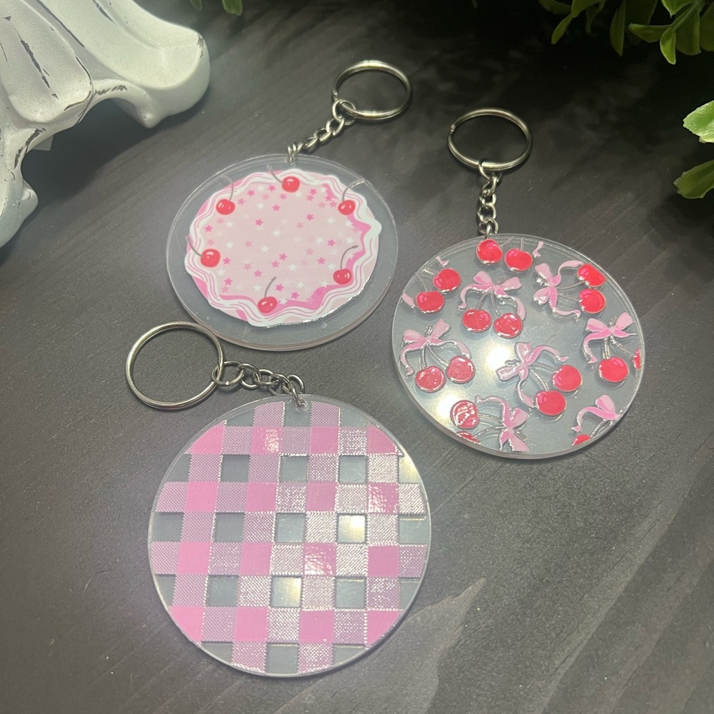 Set of Three Cute Keychains with Pink and Red Designs